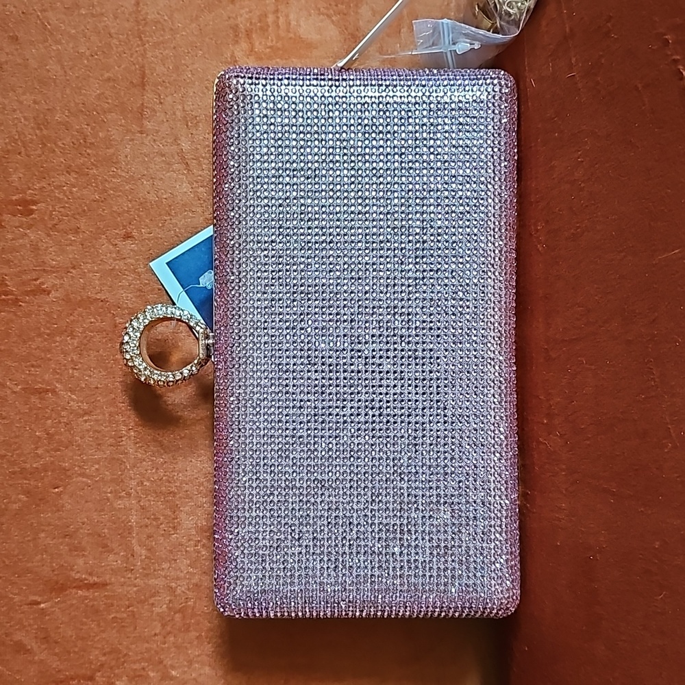 "BLING" pink clutch. 1 side of the clutch is smooth & the other side has sparkle